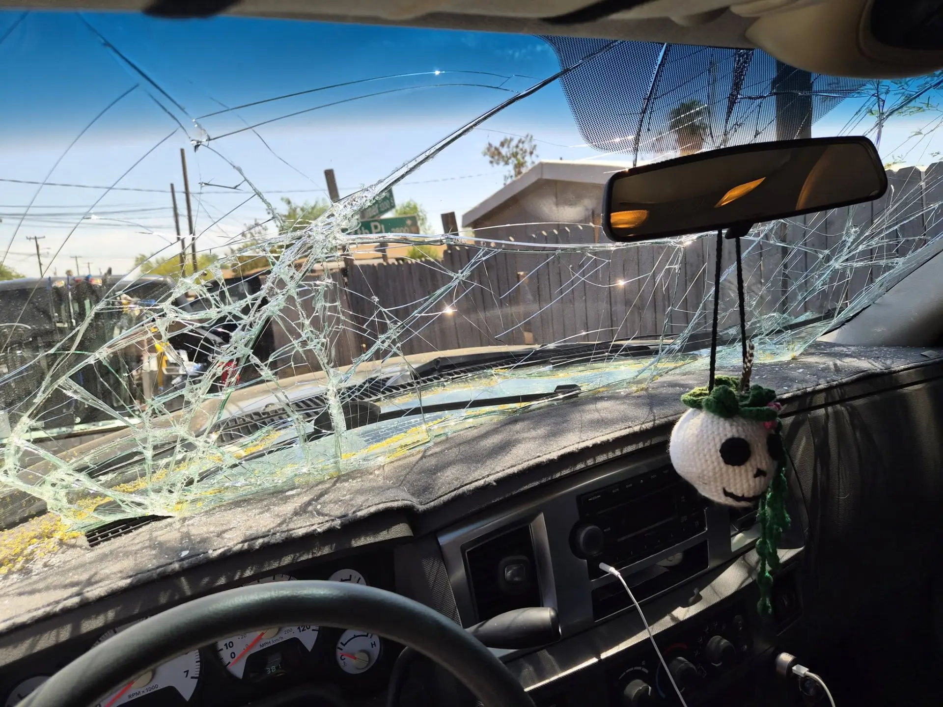 Shattered windshield seen from the driver's seat of a truck in Arizona